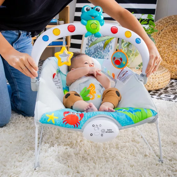 Baby Einstein Hudobné vibračné kresielko so svetielkami Kick to It Neptune do 9 kg